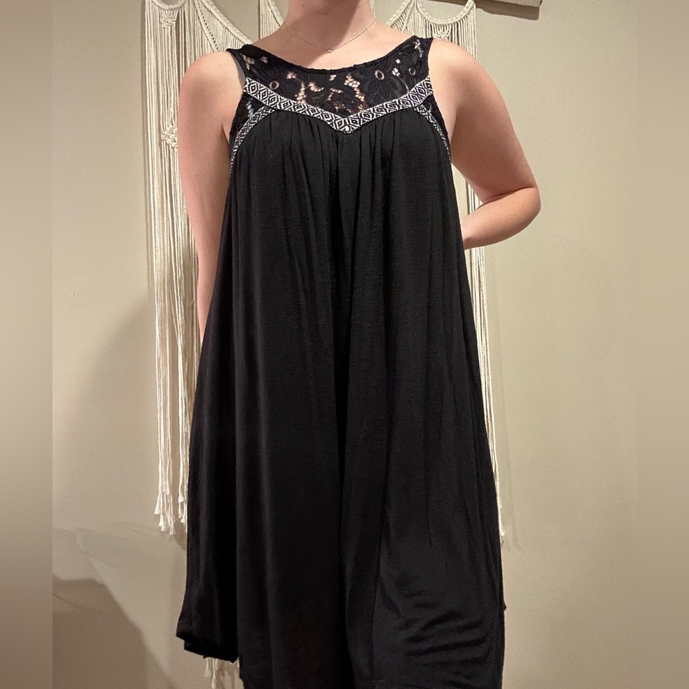 Black flowy dress with lace chest pattern